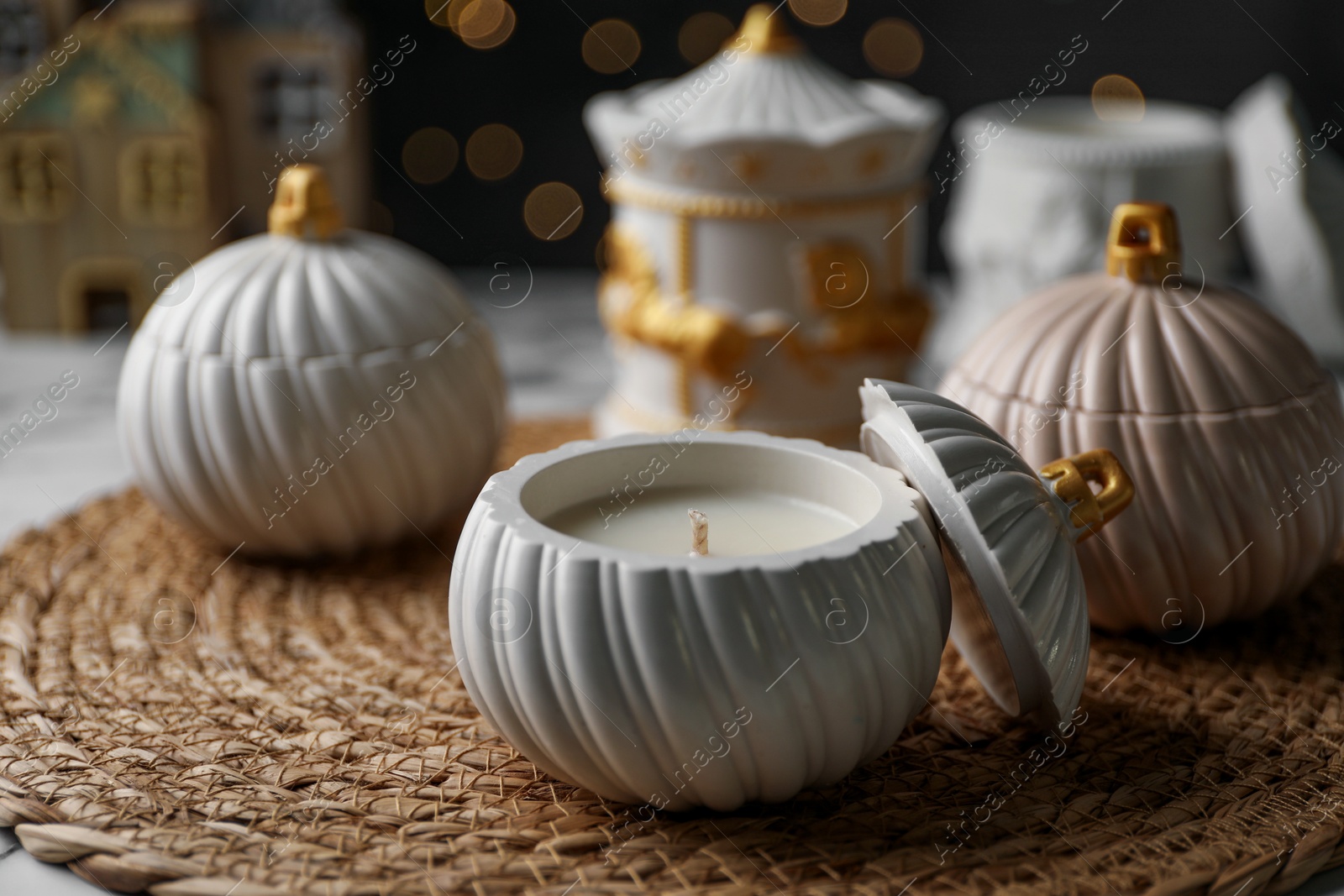 Photo of Soy wax candles on white table, closeup. Beautiful Christmas decor