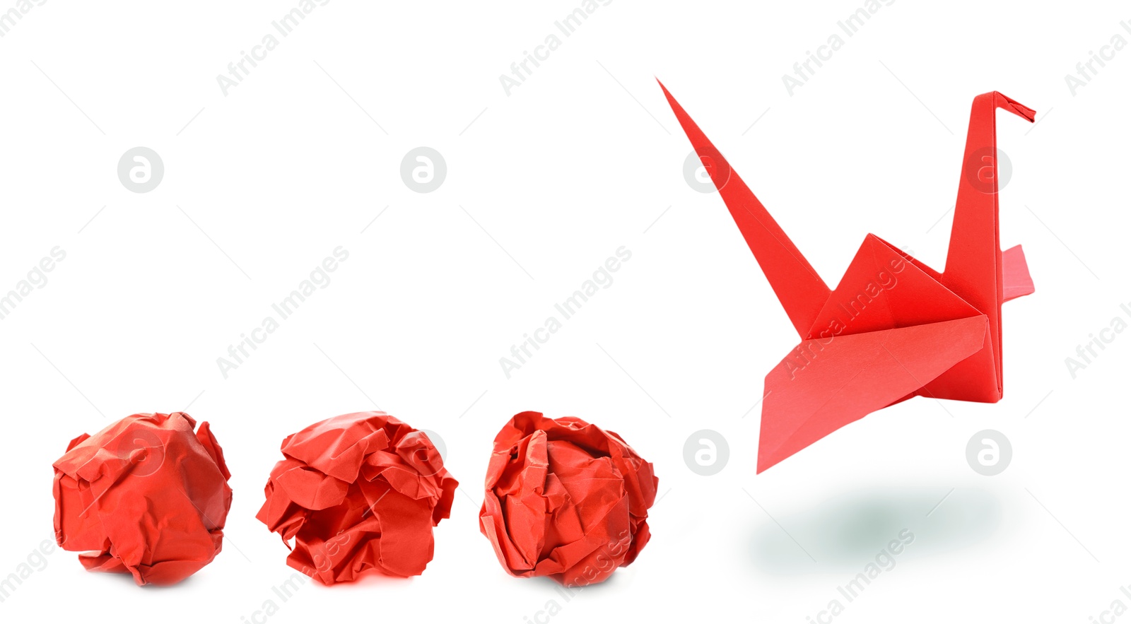 Image of Red origami crane and crumpled paper balls on white background, banner design. Transformation or new ideas concept