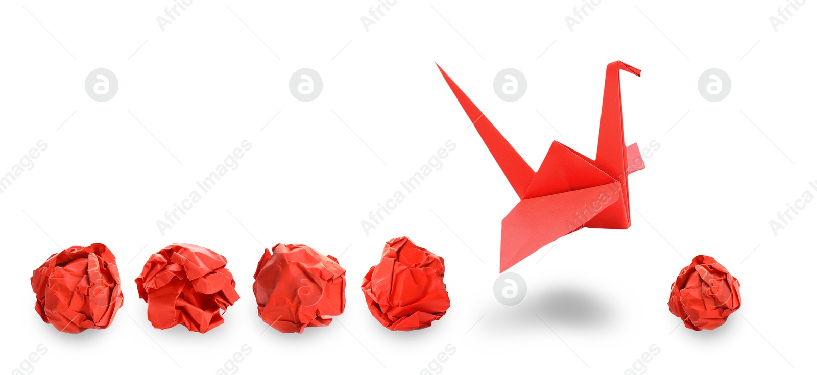 Image of Red origami crane and crumpled paper balls on white background, banner design. Transformation or leadership concept