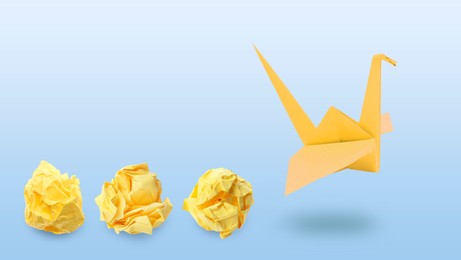 Image of Yellow origami crane and crumpled paper balls on blue gradient background, banner design. Transformation or new ideas concept