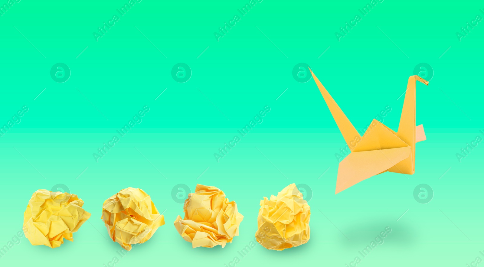 Image of Yellow origami crane and crumpled paper balls on green gradient background, banner design. Transformation or new ideas concept