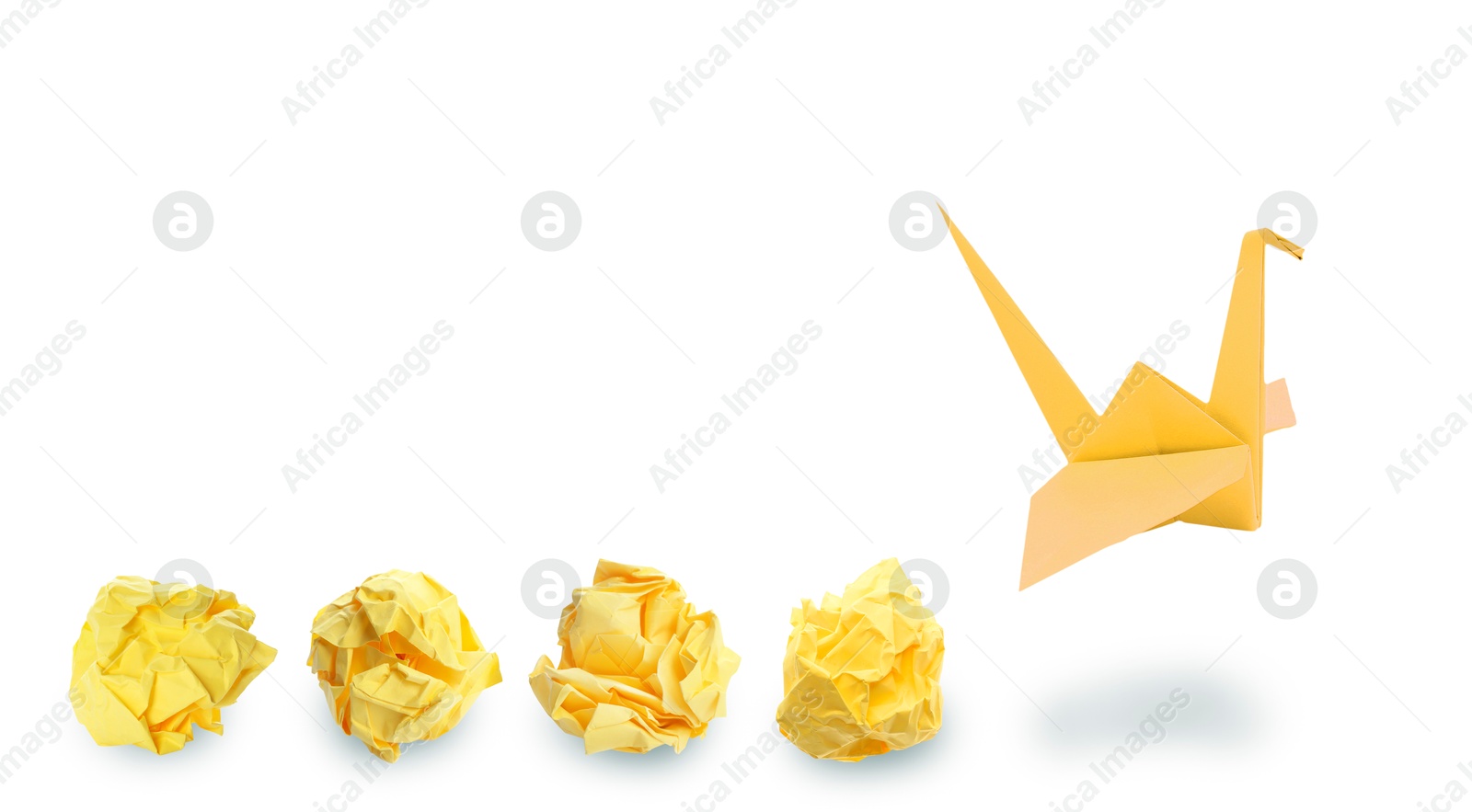 Image of Yellow origami crane and crumpled paper balls on white background, banner design. Transformation or new ideas concept