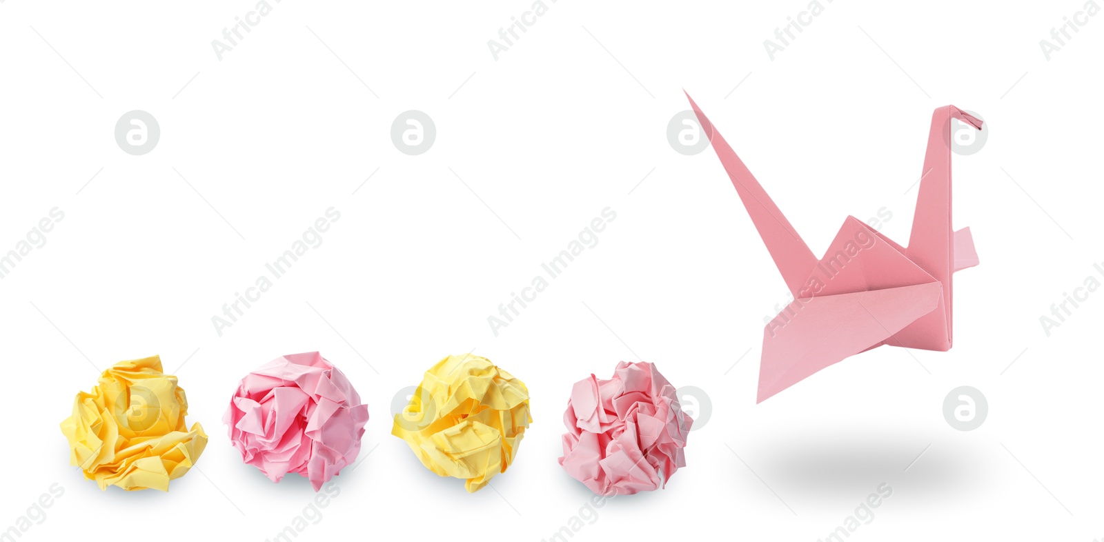 Image of Pink origami crane and crumpled paper balls on white background, banner design. Transformation or new ideas concept