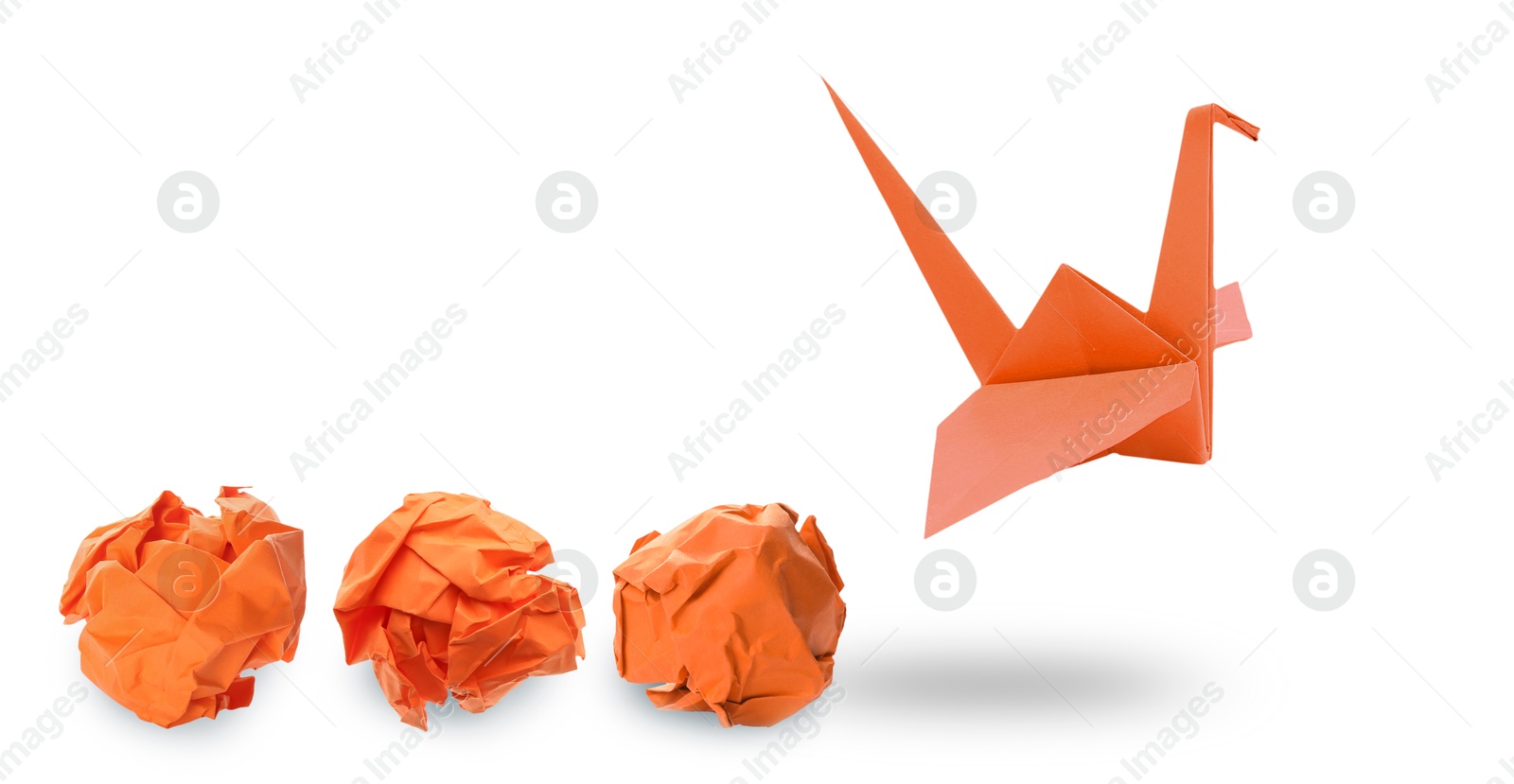 Image of Orange origami crane and crumpled paper balls on white background, banner design. Transformation or new ideas concept