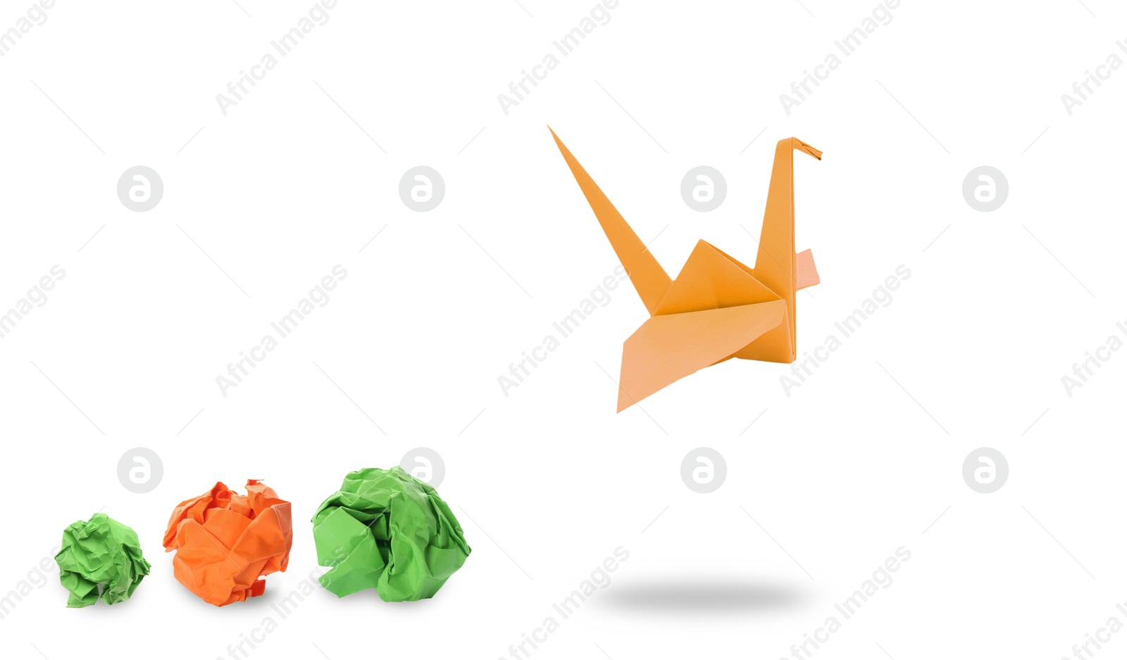 Image of Orange origami crane and crumpled paper balls on white background, banner design. Transformation or new ideas concept