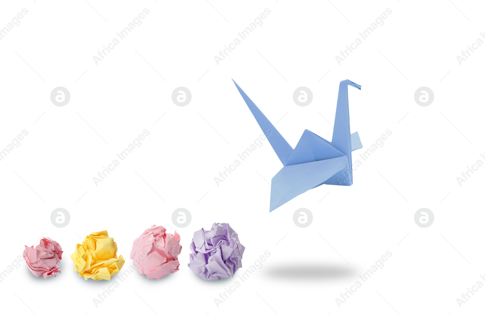 Image of Blue origami crane and crumpled paper balls on white background, banner design. Transformation or new ideas concept