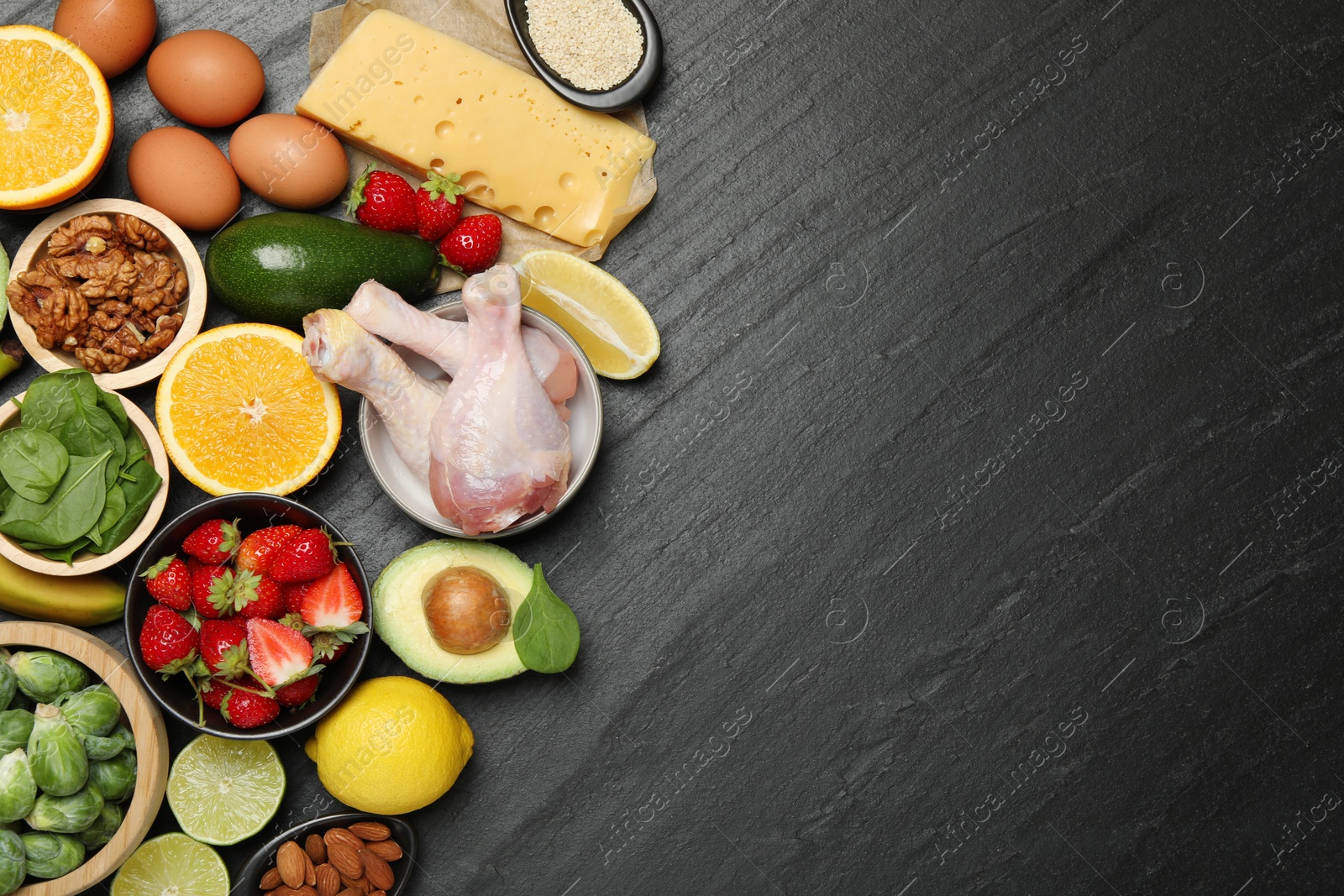 Photo of Different fresh products rich in dopamine on grey textured table, flat lay. Space for text