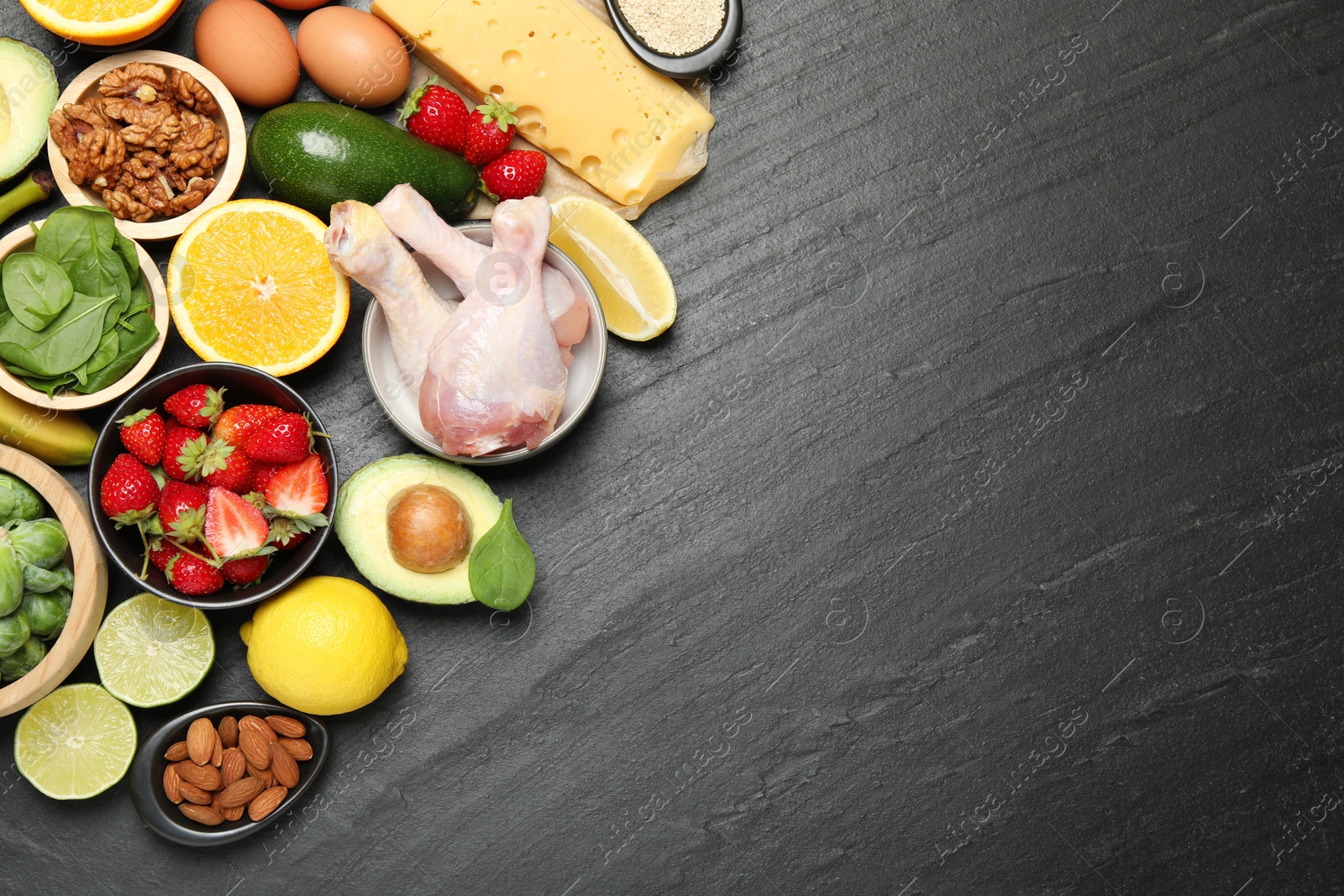 Photo of Different fresh products rich in dopamine on grey textured table, flat lay. Space for text