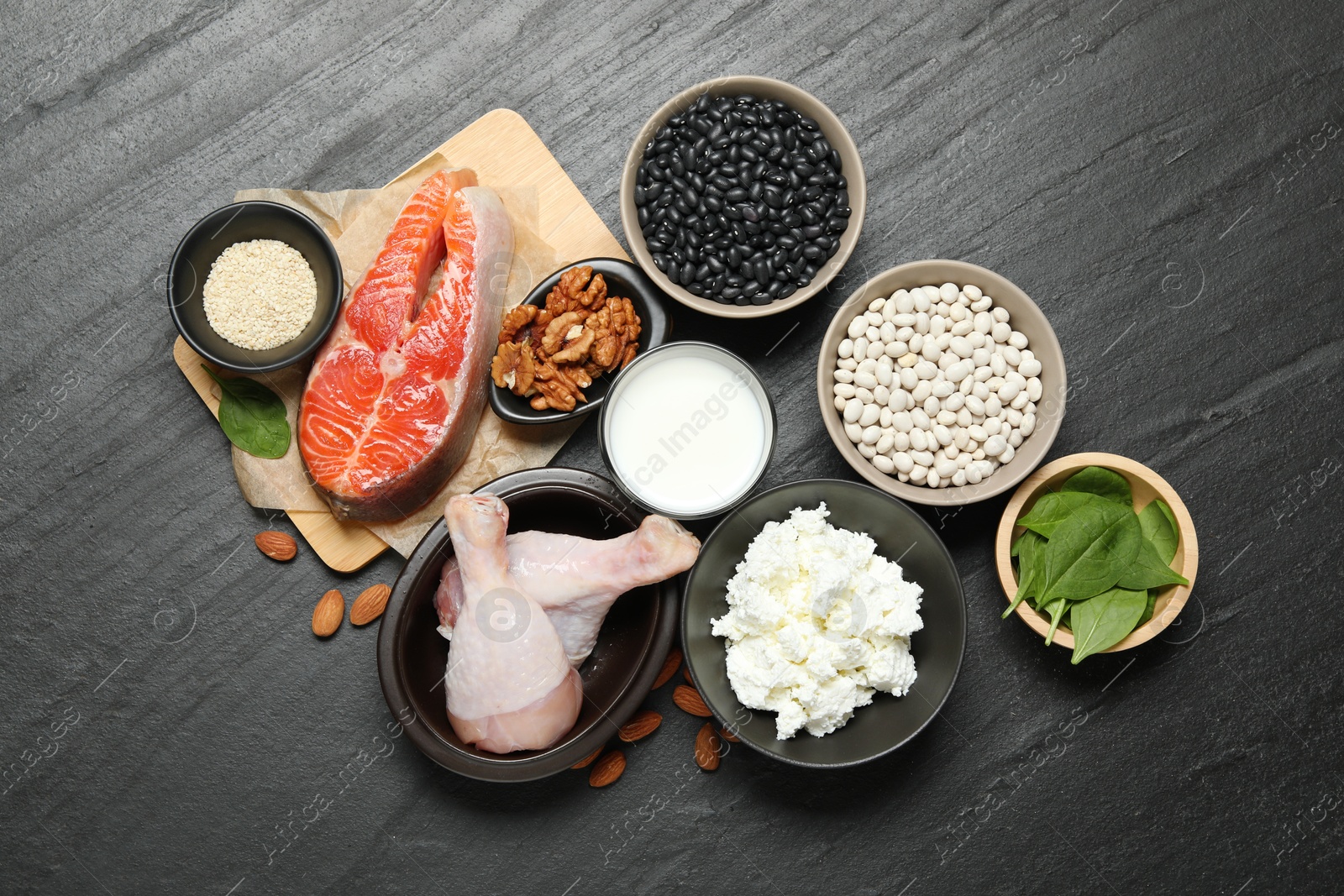 Photo of Different fresh products rich in estrogen on grey textured table, flat lay