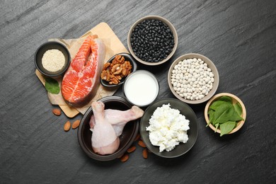 Photo of Different fresh products rich in estrogen on grey textured table, flat lay