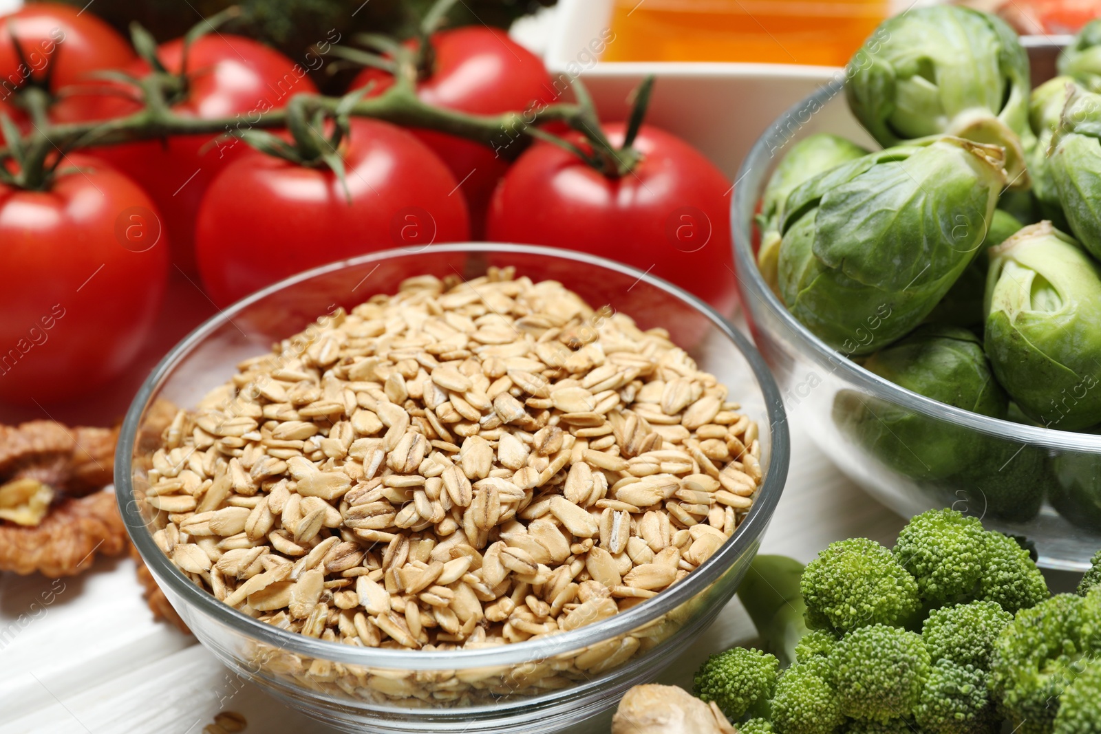 Photo of Different fresh products rich in melatonin on white table, closeup