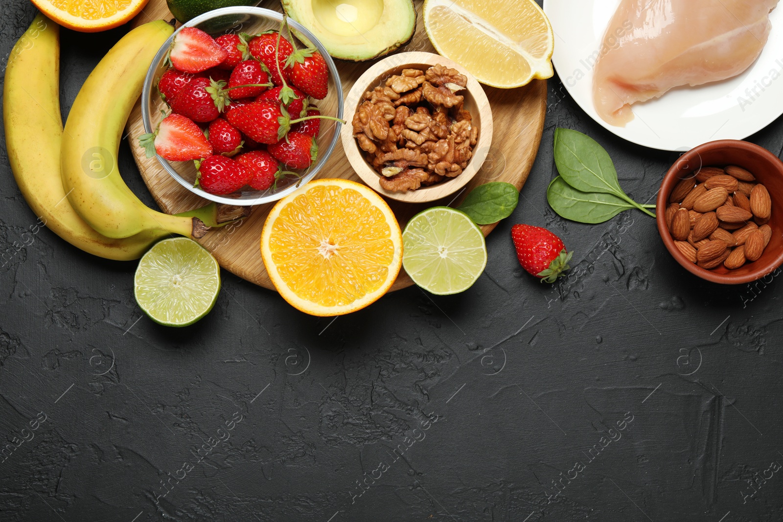 Photo of Different fresh products rich in dopamine on grey textured table, flat lay. Space for text