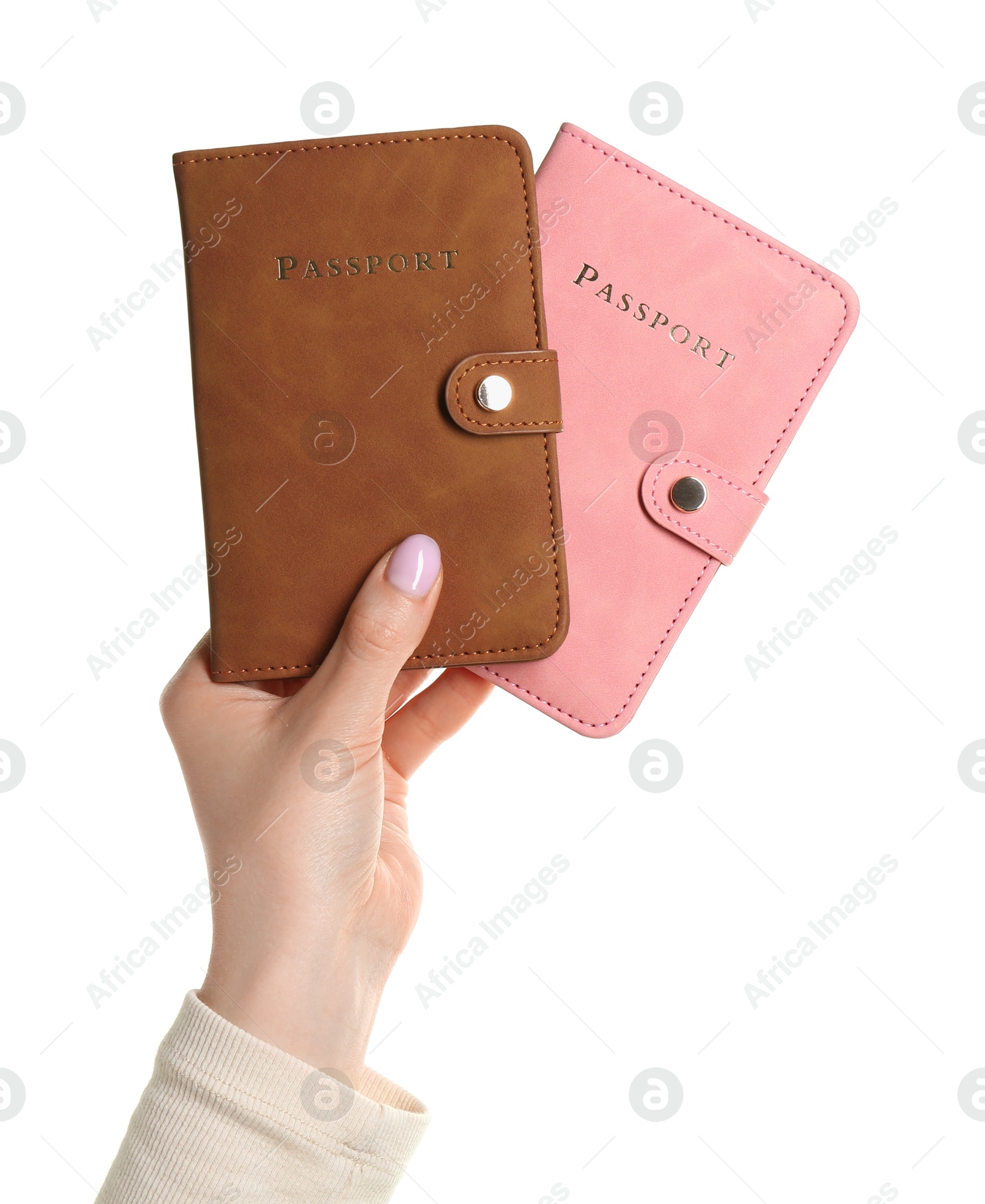 Photo of Woman holding passports in color covers on white background, closeup