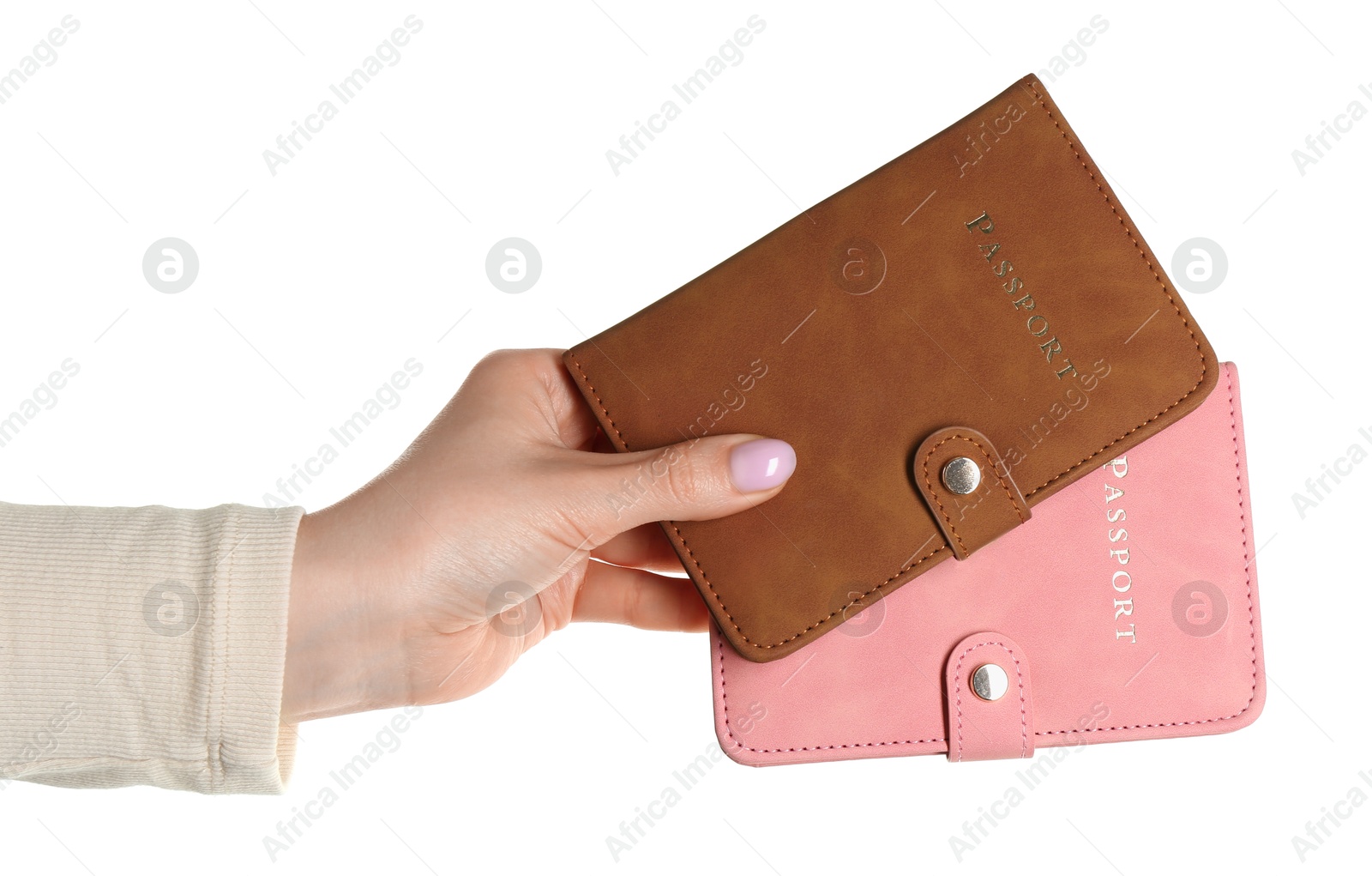 Photo of Woman holding passports in color covers on white background, closeup