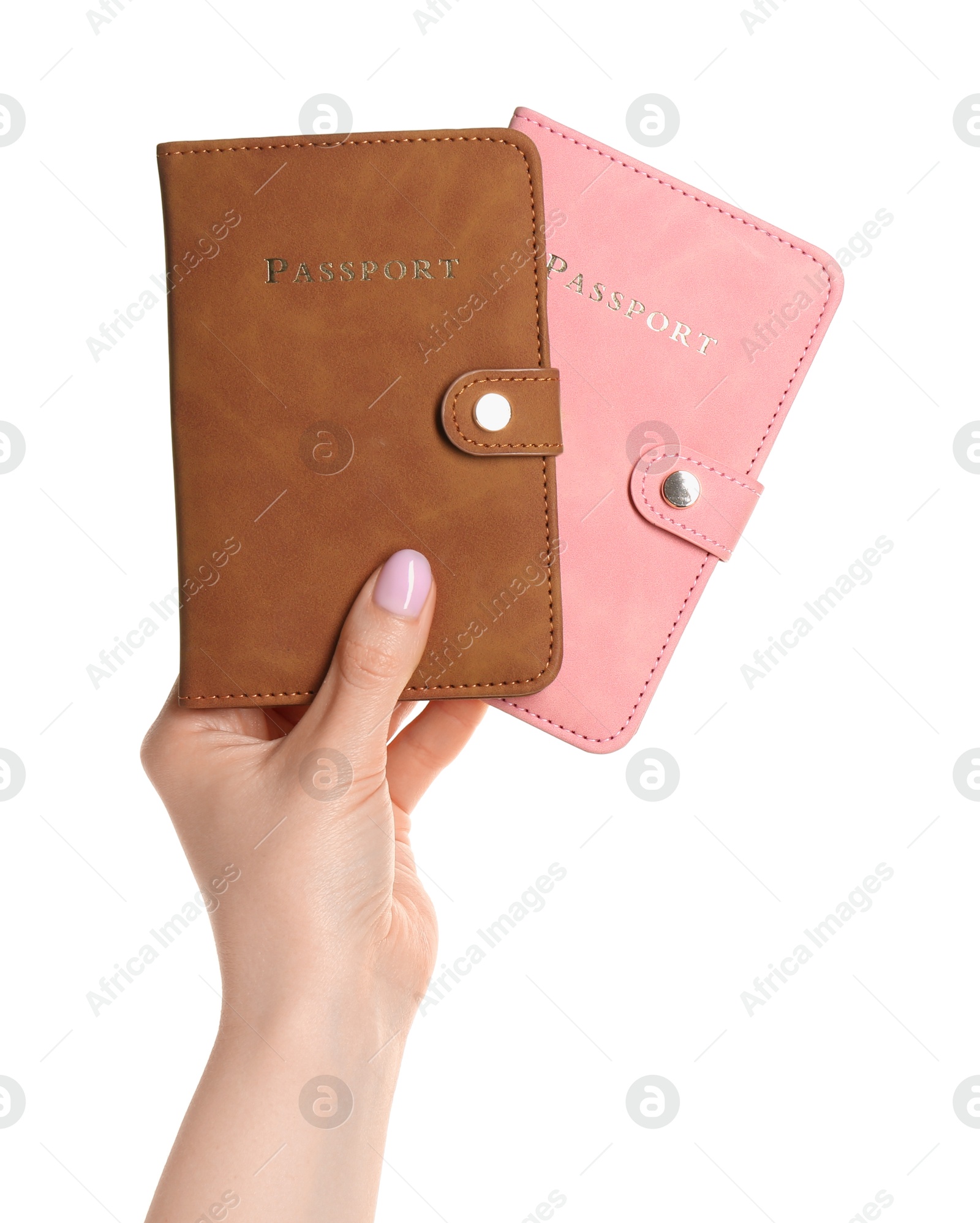 Photo of Woman holding passports in color covers on white background, closeup