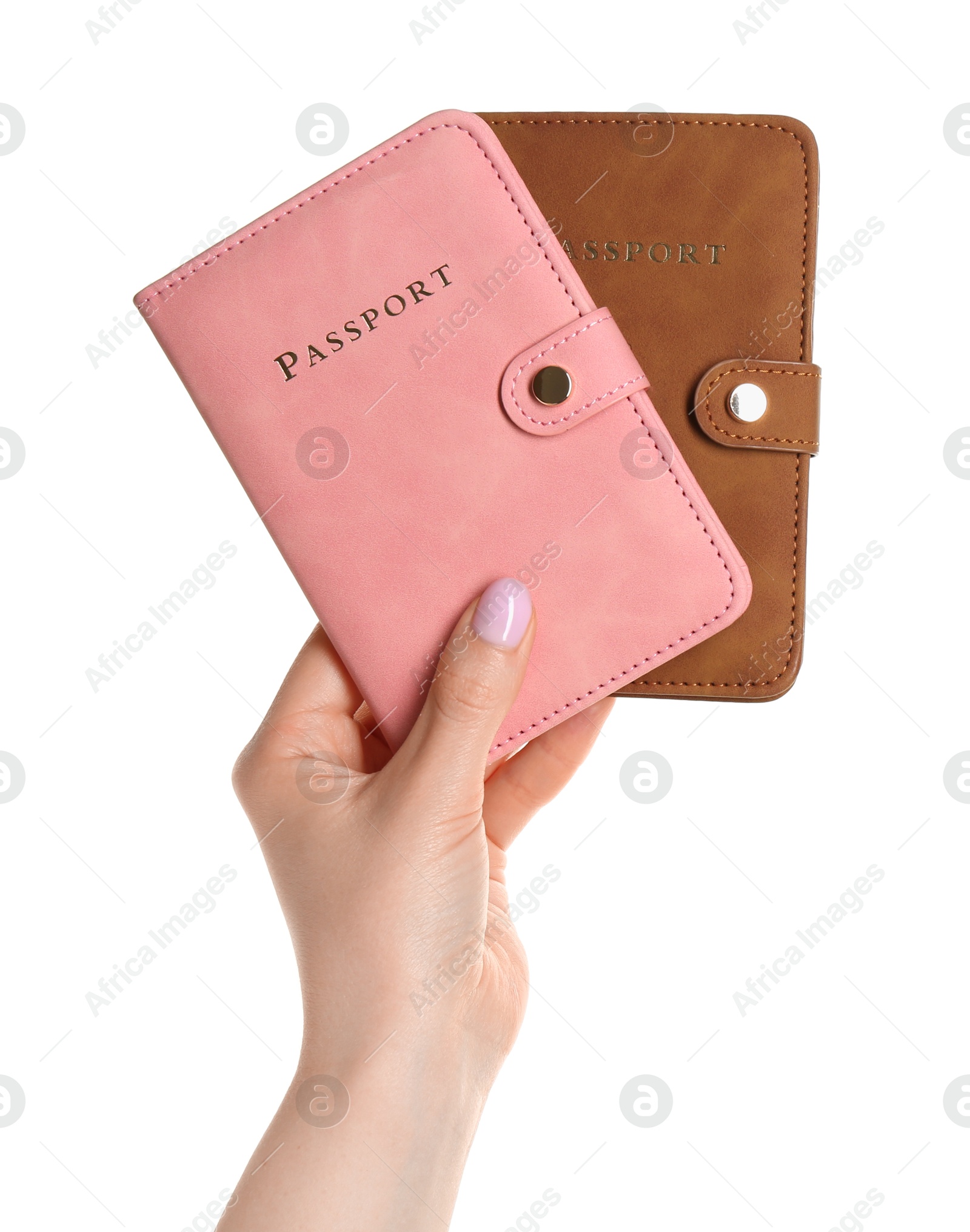 Photo of Woman holding passports in color covers on white background, closeup