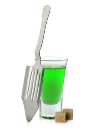 Photo of Absinthe in shot glass, brown sugar and slotted spoon isolated on white