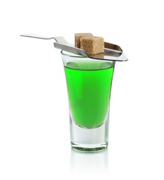 Photo of Absinthe in shot glass, brown sugar and slotted spoon isolated on white