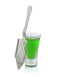 Photo of Absinthe in shot glass and slotted spoon isolated on white