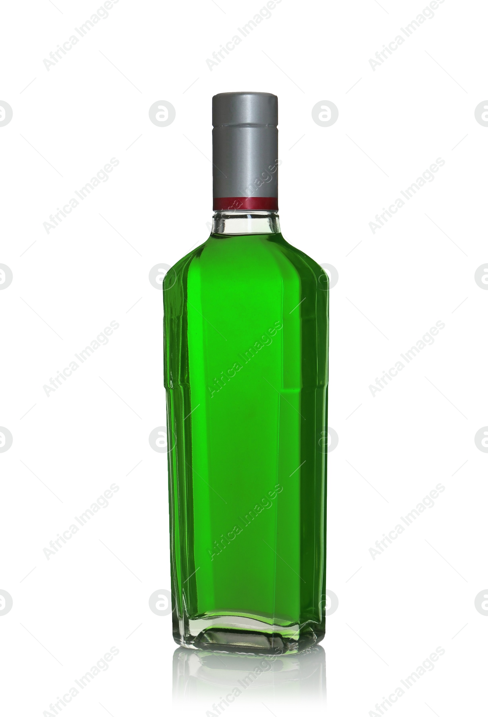 Photo of Absinthe in glass bottle isolated on white