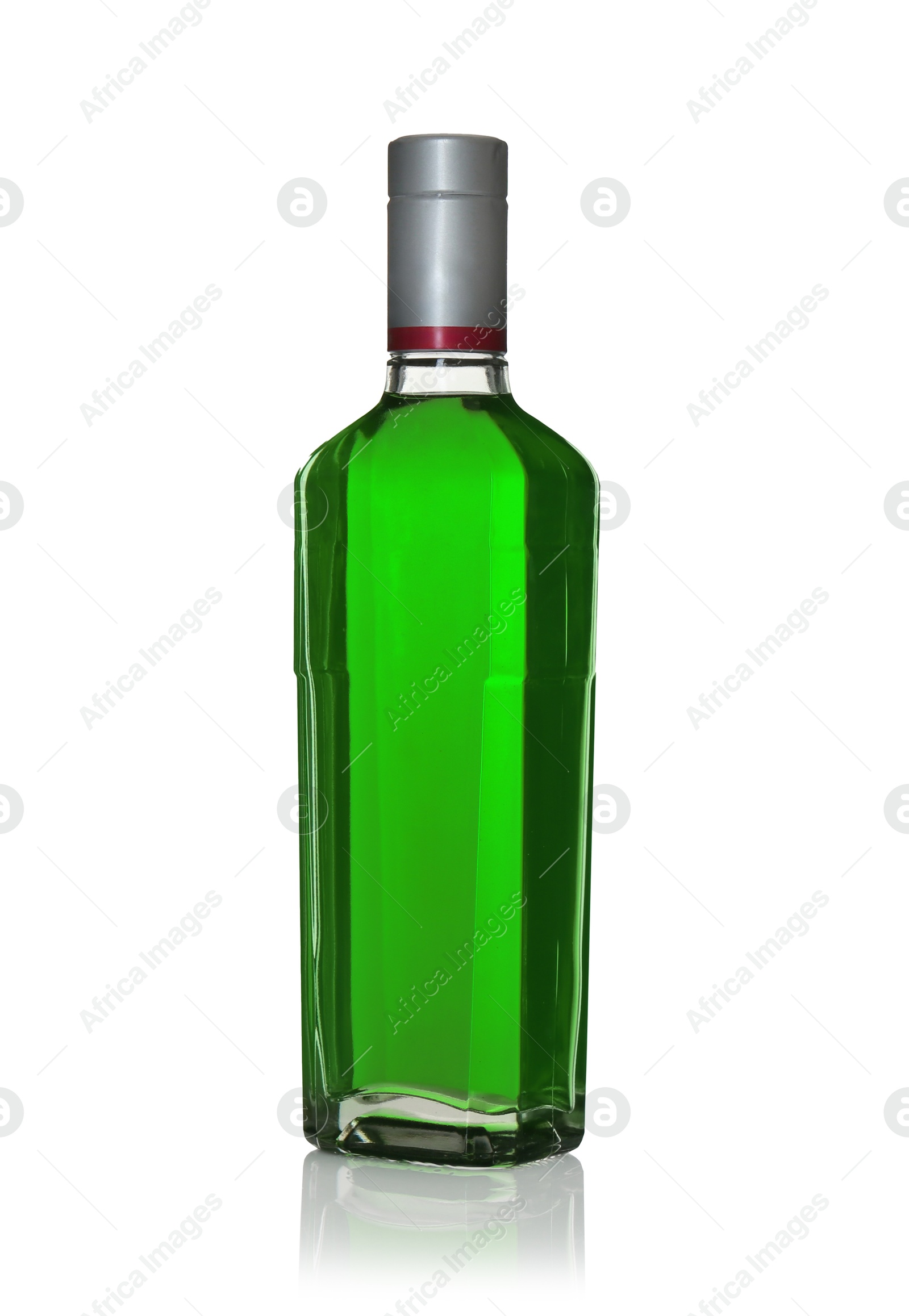 Photo of Absinthe in glass bottle isolated on white