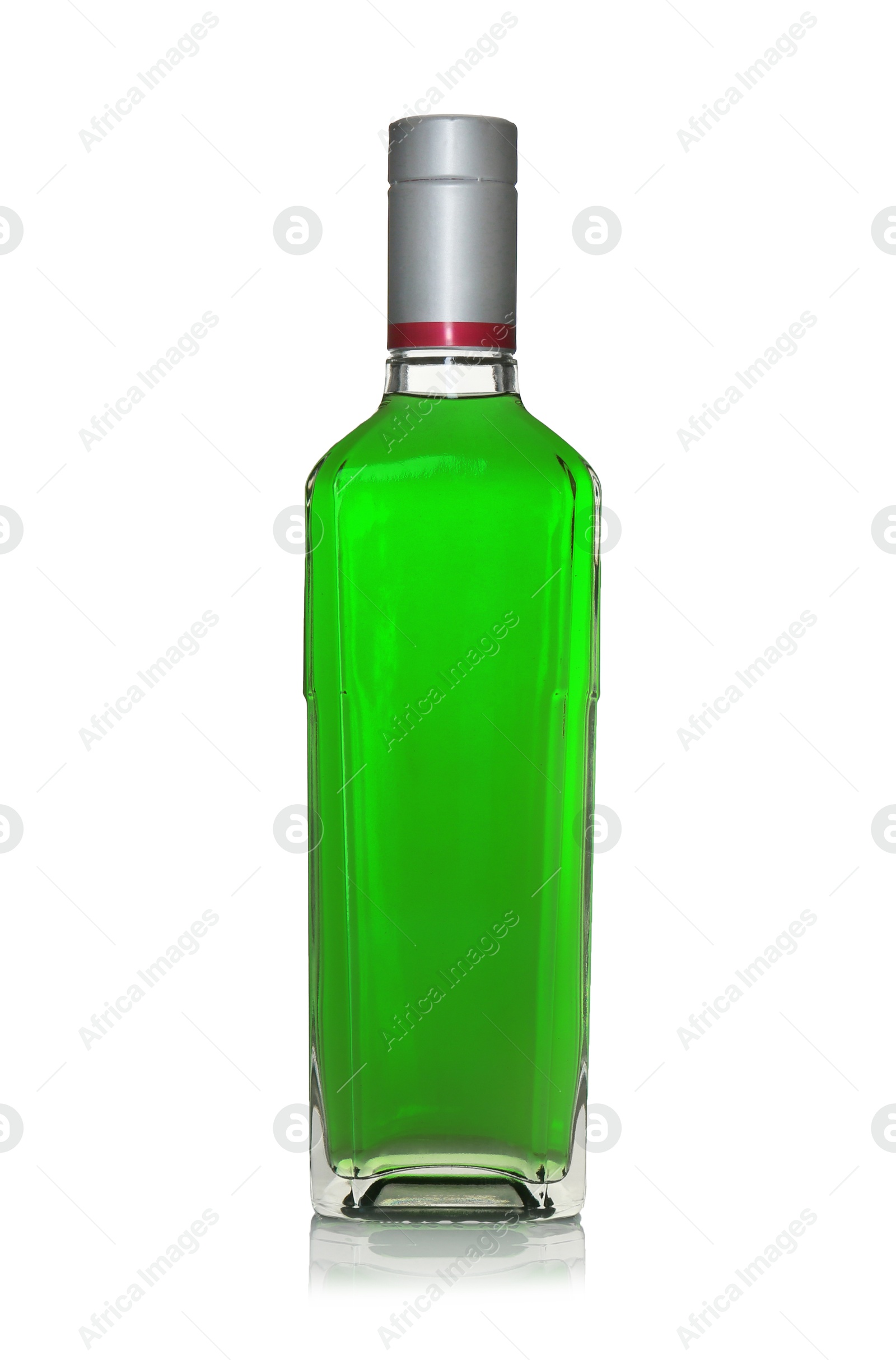 Photo of Absinthe in glass bottle isolated on white