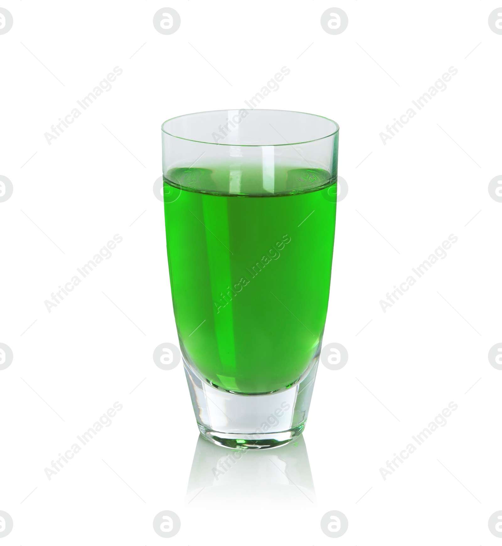 Photo of Absinthe in shot glass isolated on white