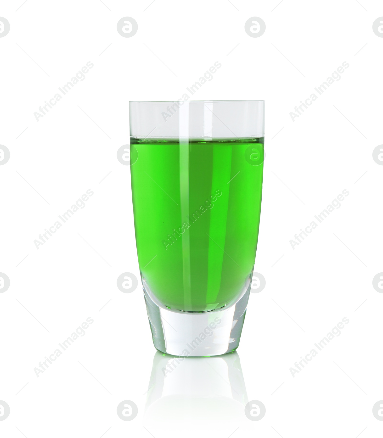 Photo of Absinthe in shot glass isolated on white