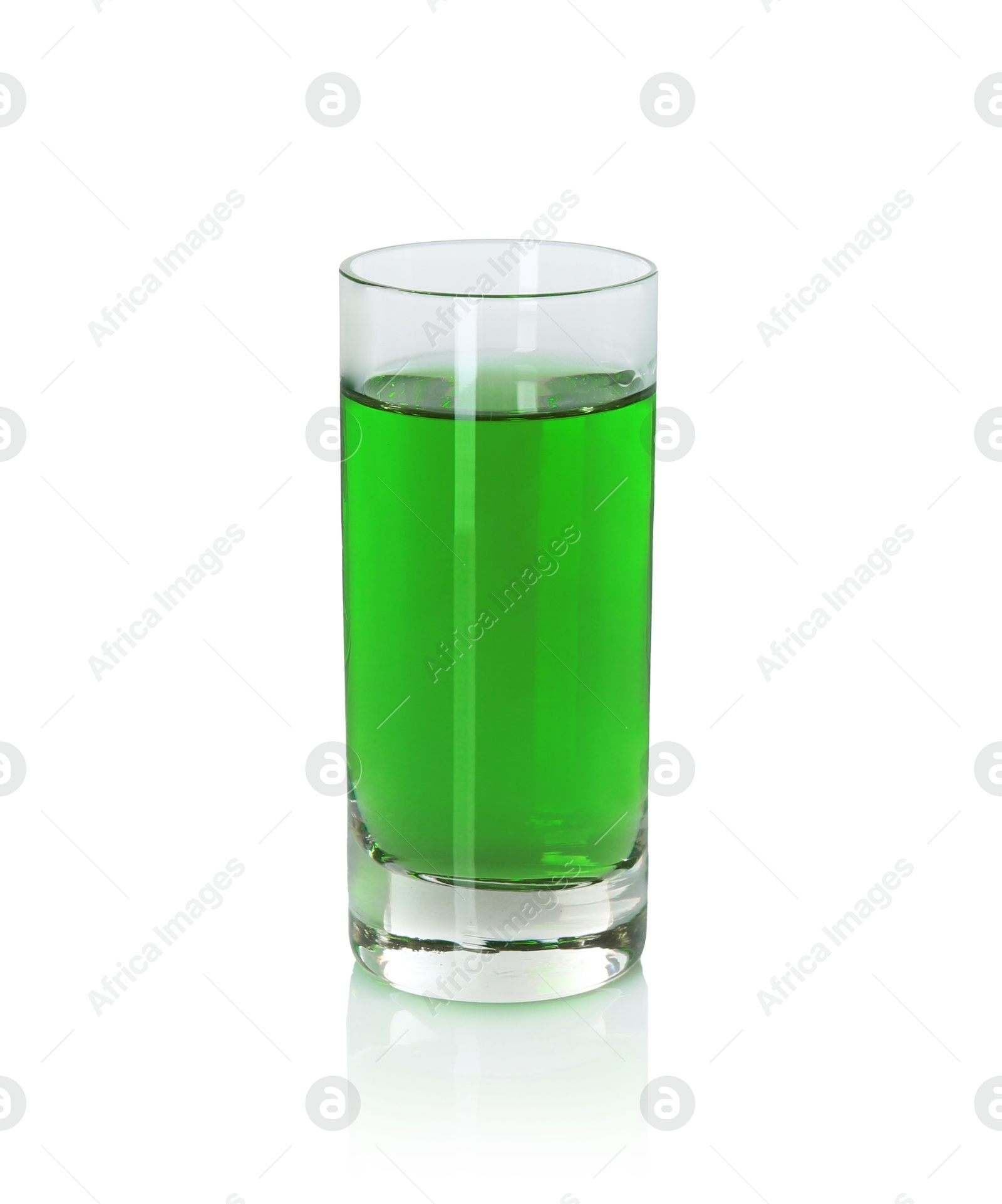 Photo of Absinthe in shot glass isolated on white