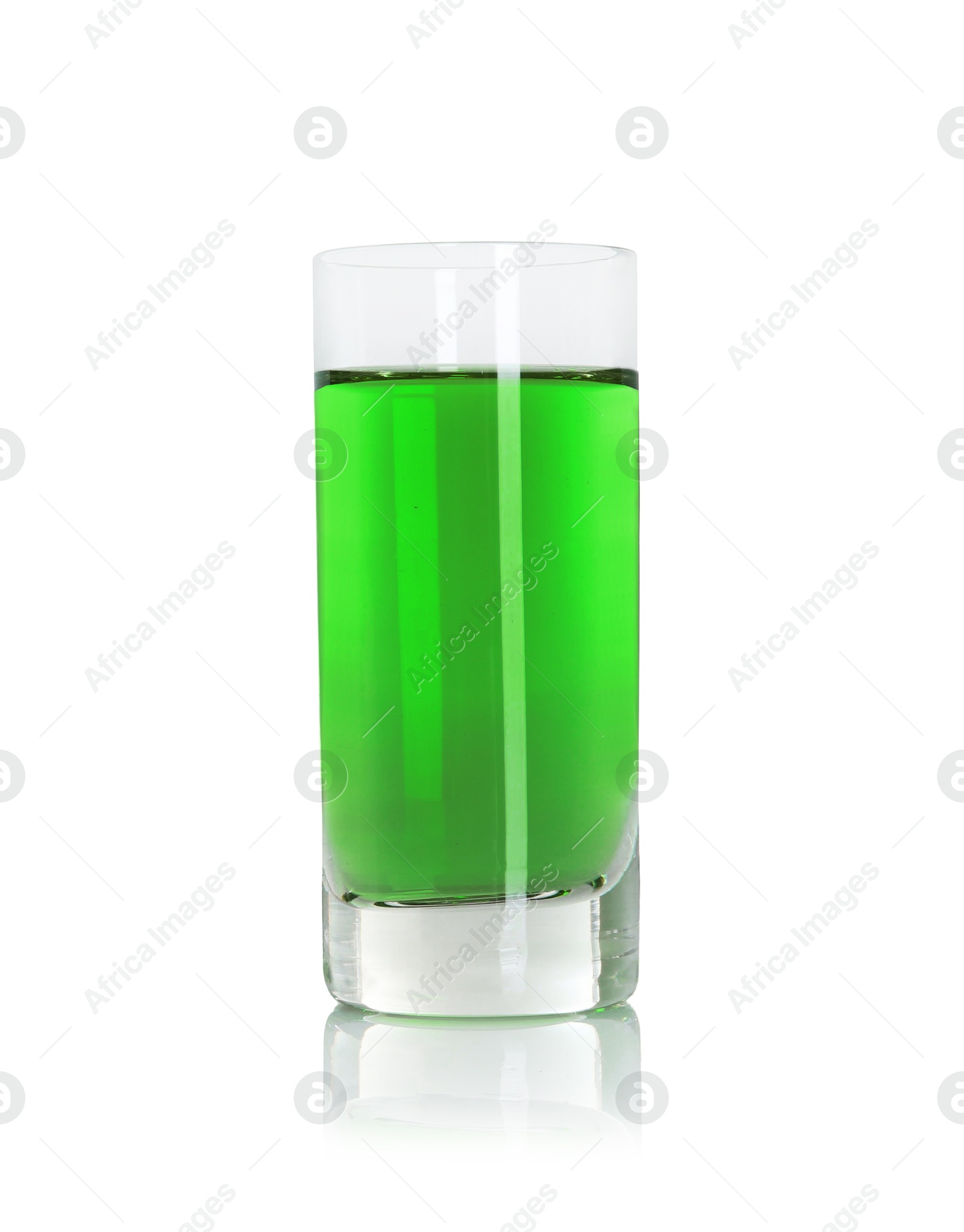 Photo of Absinthe in shot glass isolated on white