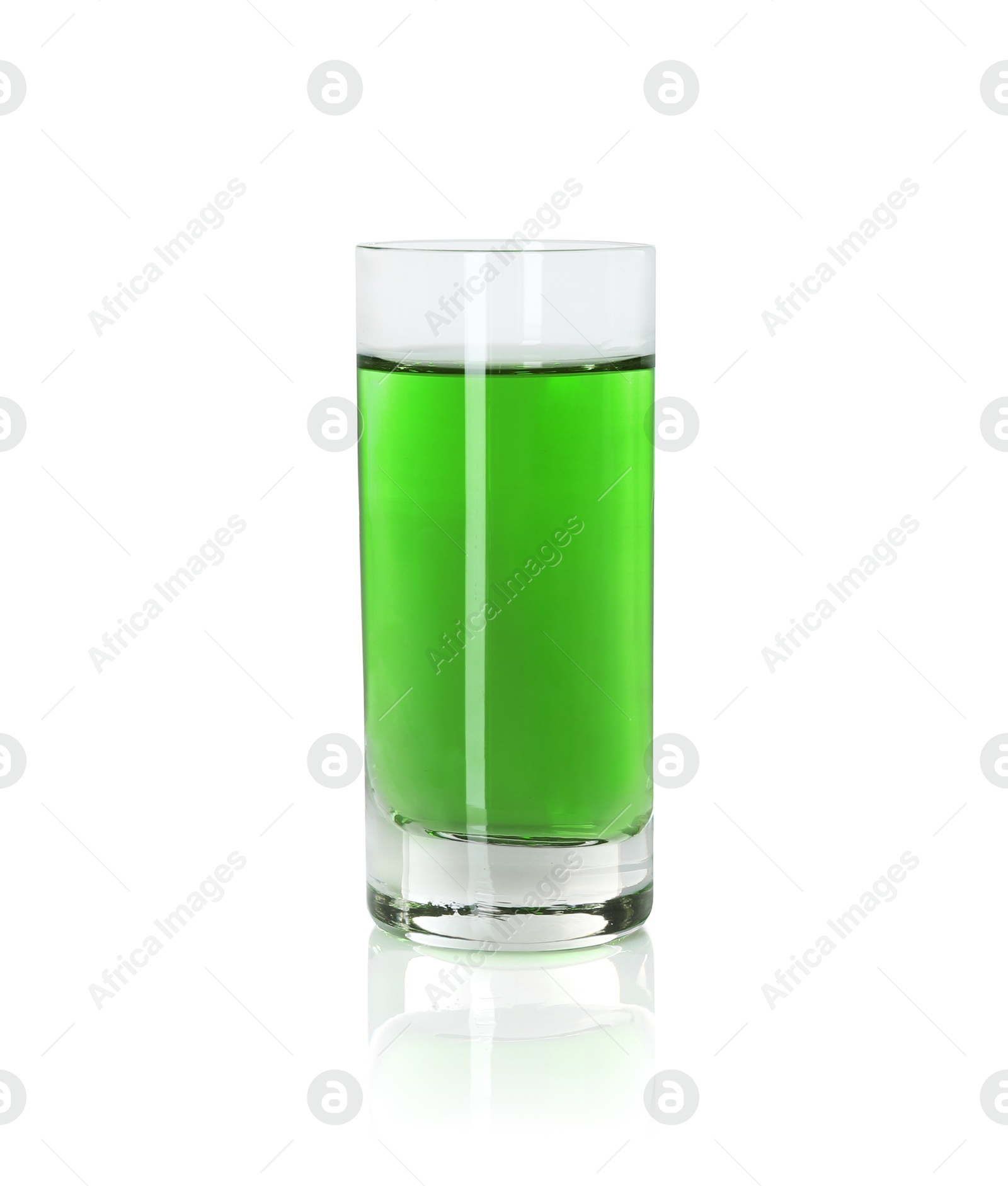 Photo of Absinthe in shot glass isolated on white