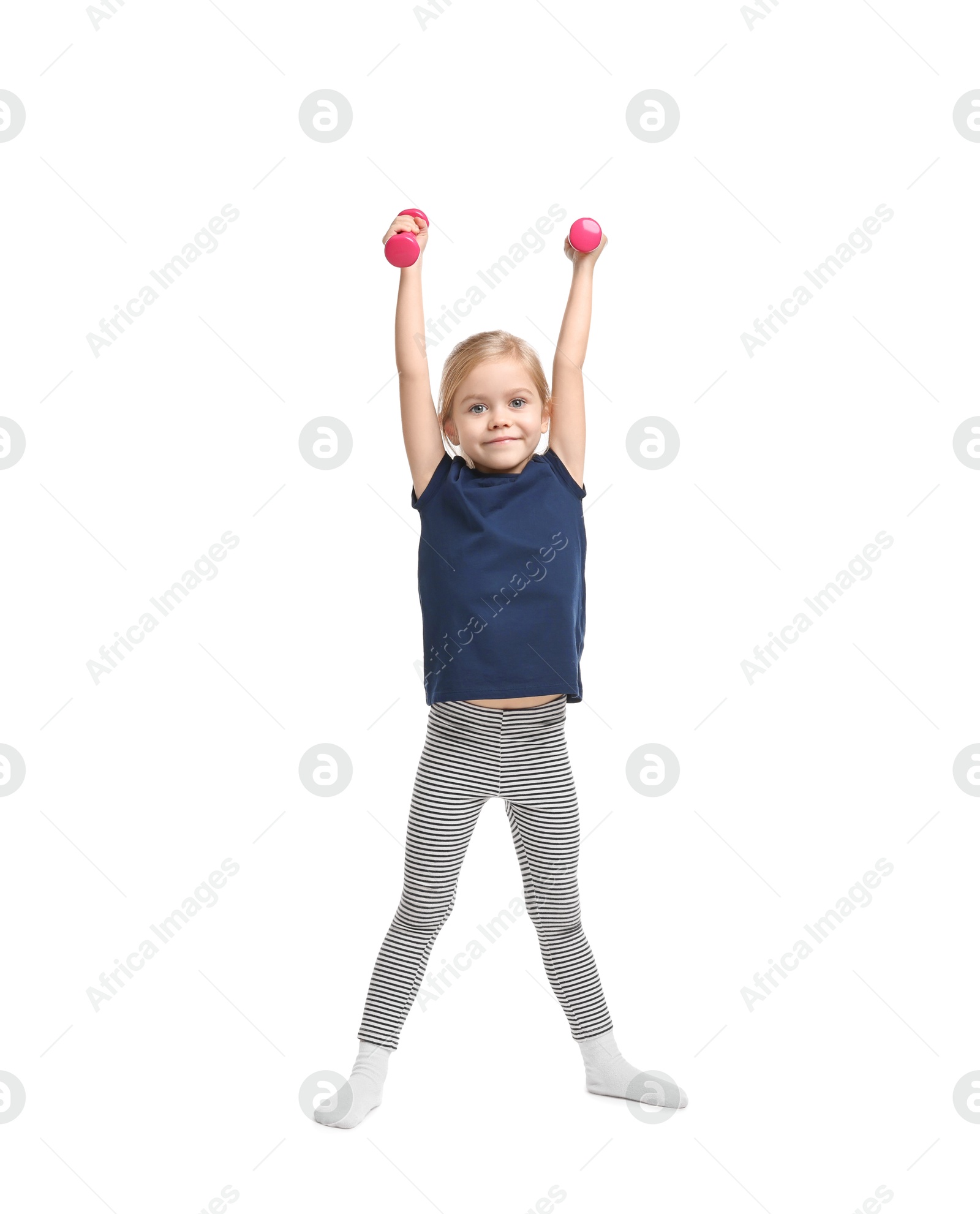 Photo of Little girl exercising with dumbbells on white background. Sport activity