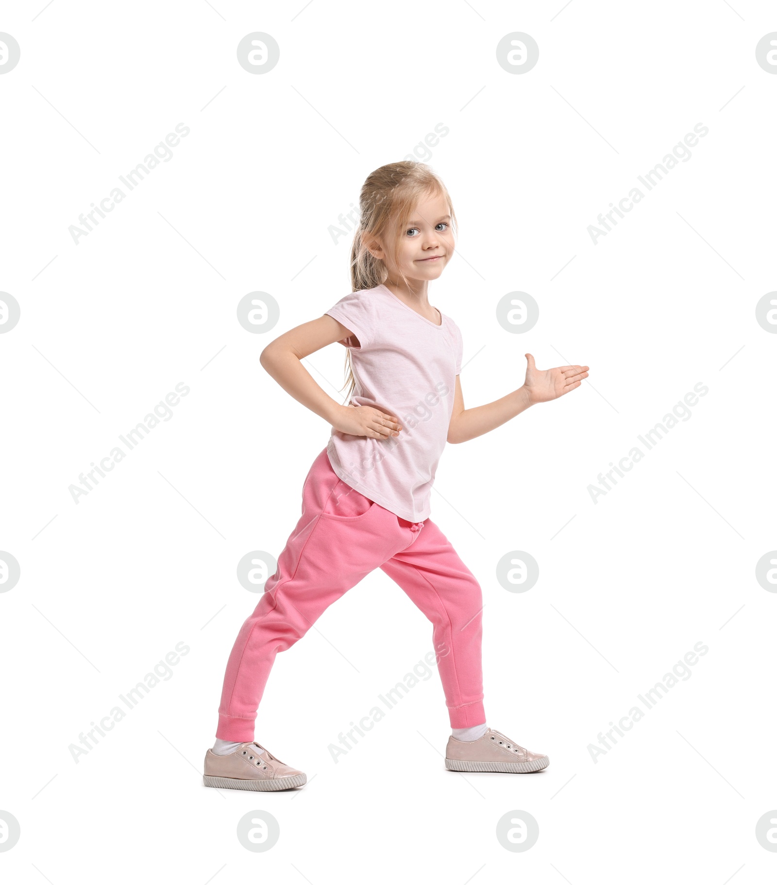 Photo of Little girl exercising on white background. Sport activity