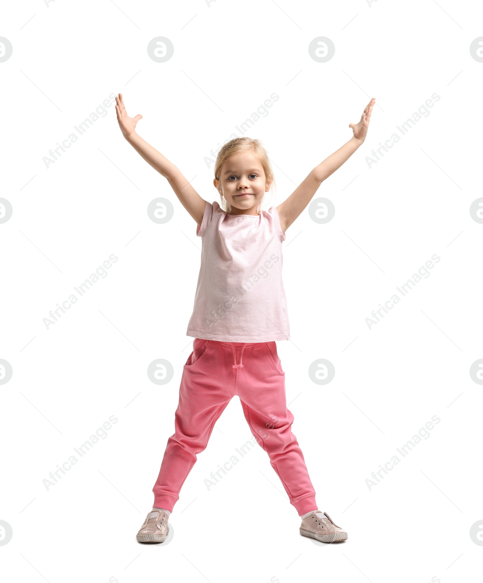 Photo of Little girl exercising on white background. Sport activity