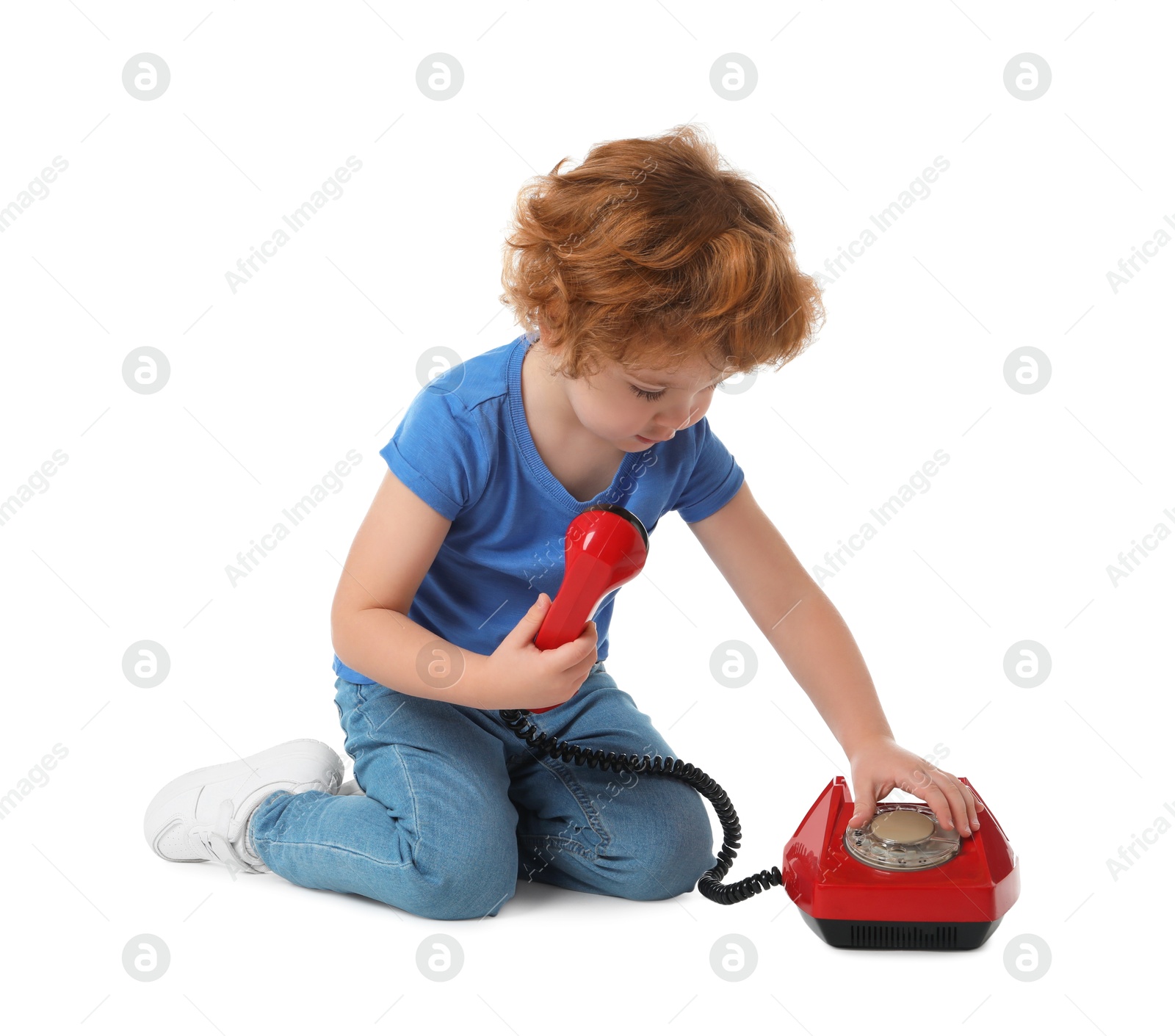 Photo of Cute little boy with telephone on white background