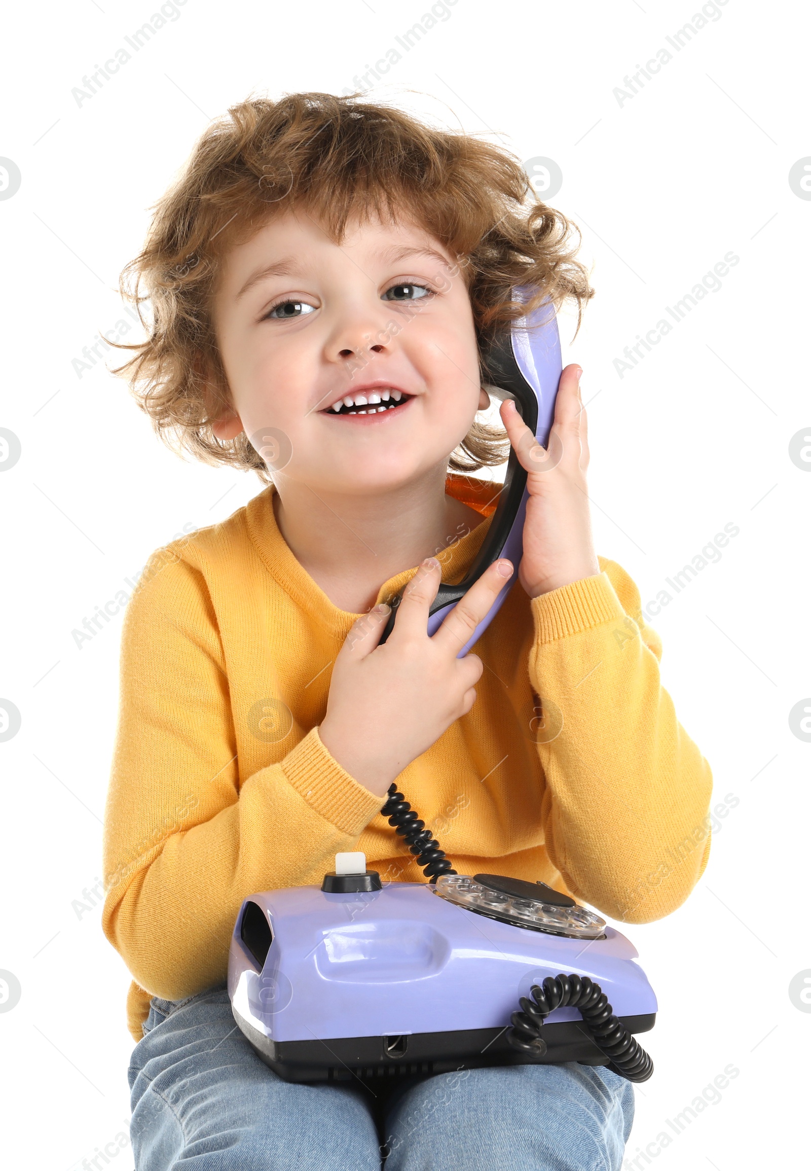 Photo of Cute little boy with telephone on white background