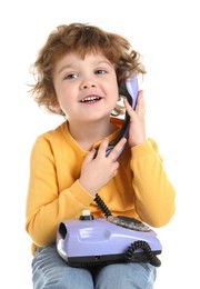 Photo of Cute little boy with telephone on white background