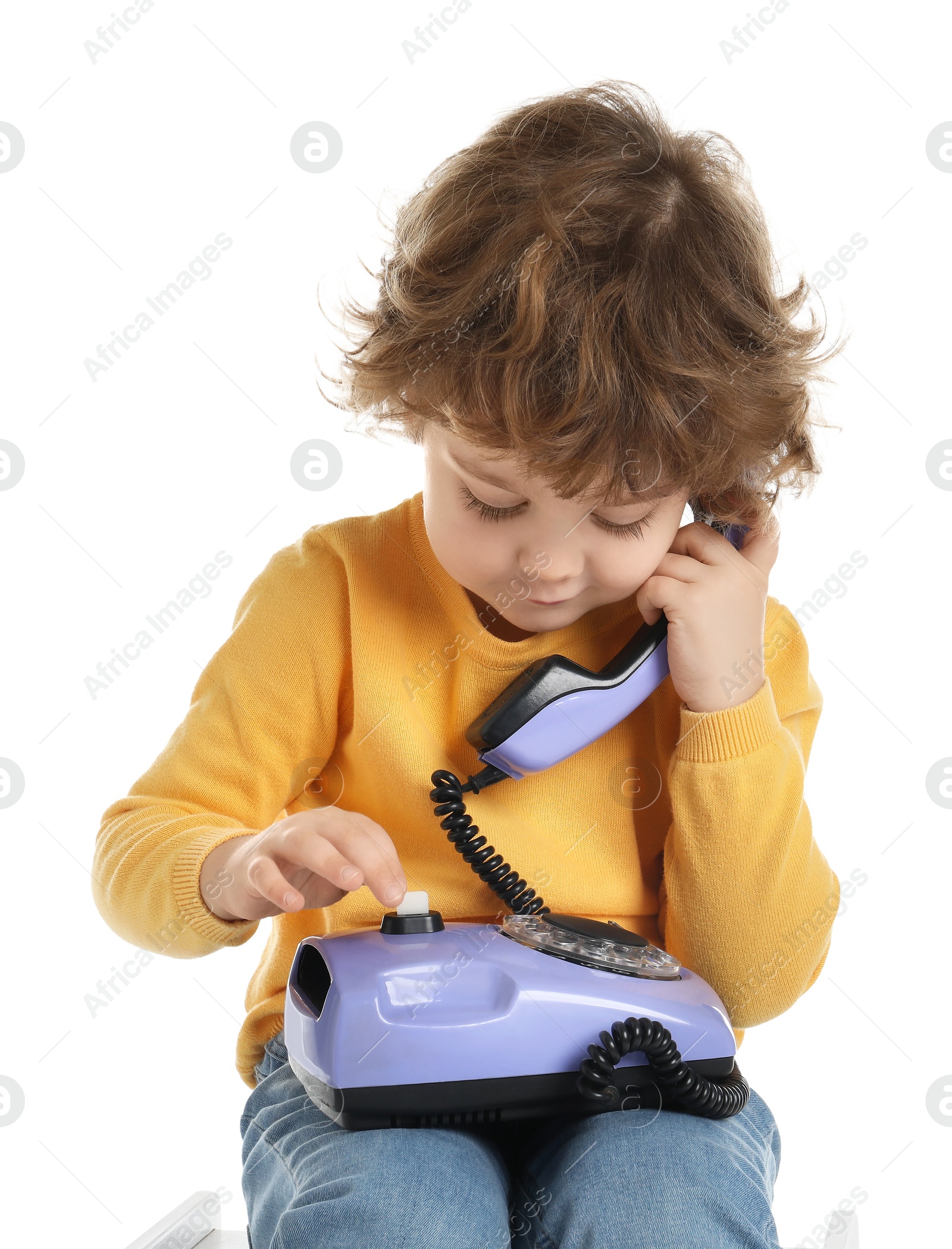 Photo of Cute little boy with telephone on white background