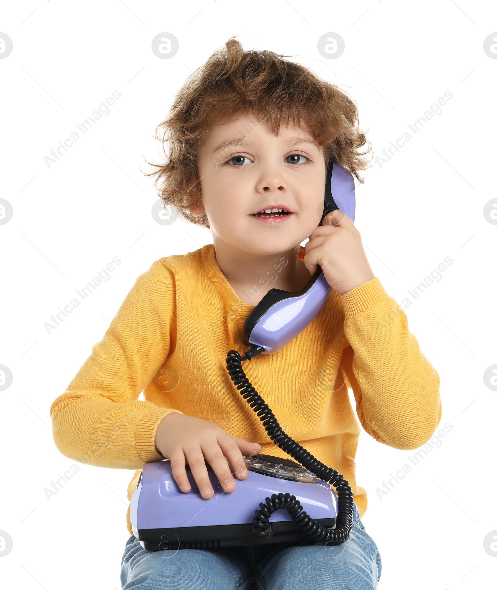 Photo of Cute little boy with telephone on white background