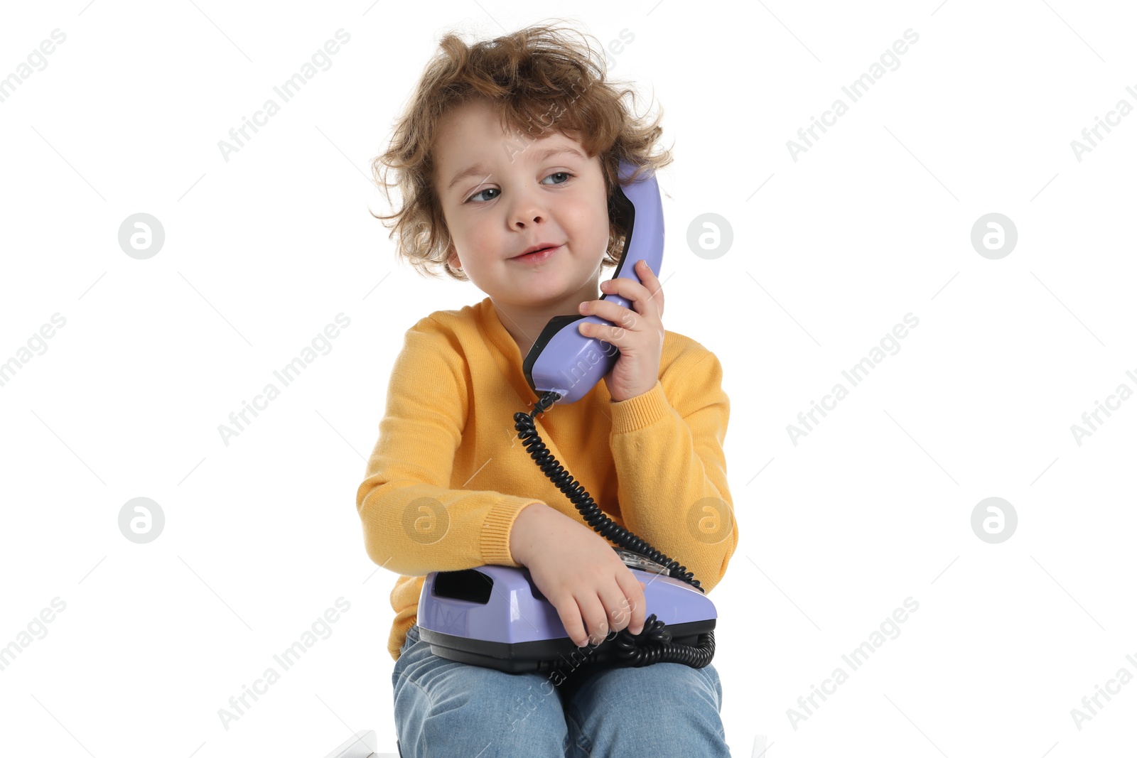 Photo of Cute little boy with telephone on white background