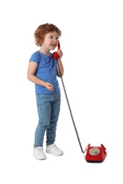 Photo of Cute little boy with telephone on white background