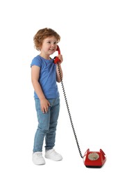 Photo of Cute little boy with telephone on white background