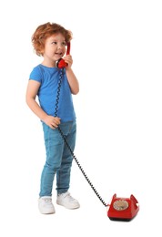 Photo of Cute little boy with telephone on white background