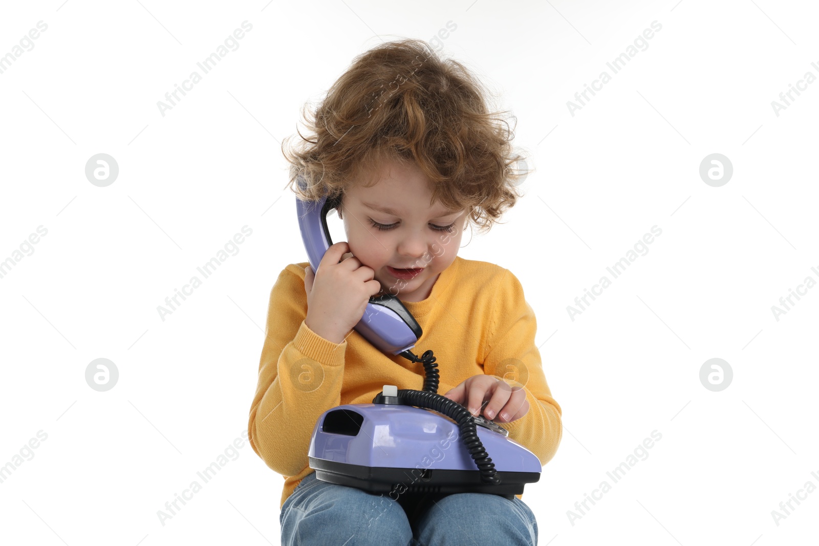 Photo of Cute little boy with telephone on white background