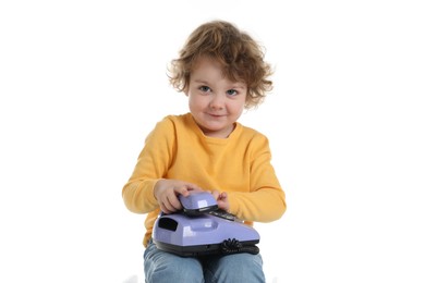 Photo of Cute little boy with telephone on white background