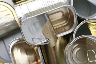 Photo of Many open tin cans as background, top view