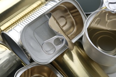 Photo of Many open tin cans as background, closeup