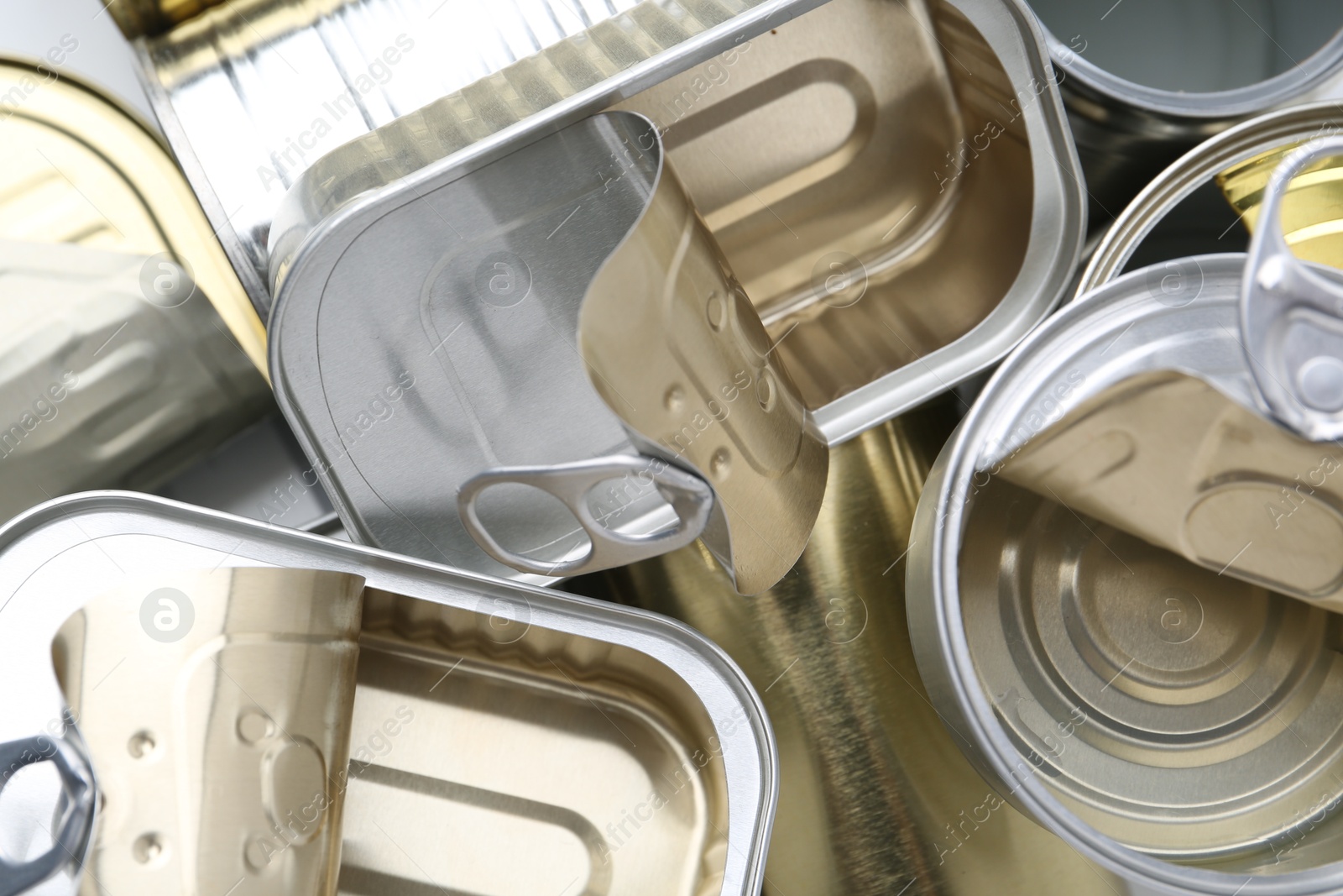 Photo of Many open tin cans as background, top view