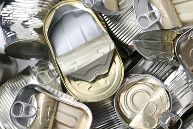 Photo of Many crumpled tin cans as background, top view