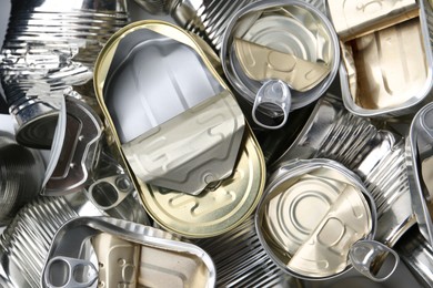 Photo of Many crumpled tin cans as background, top view